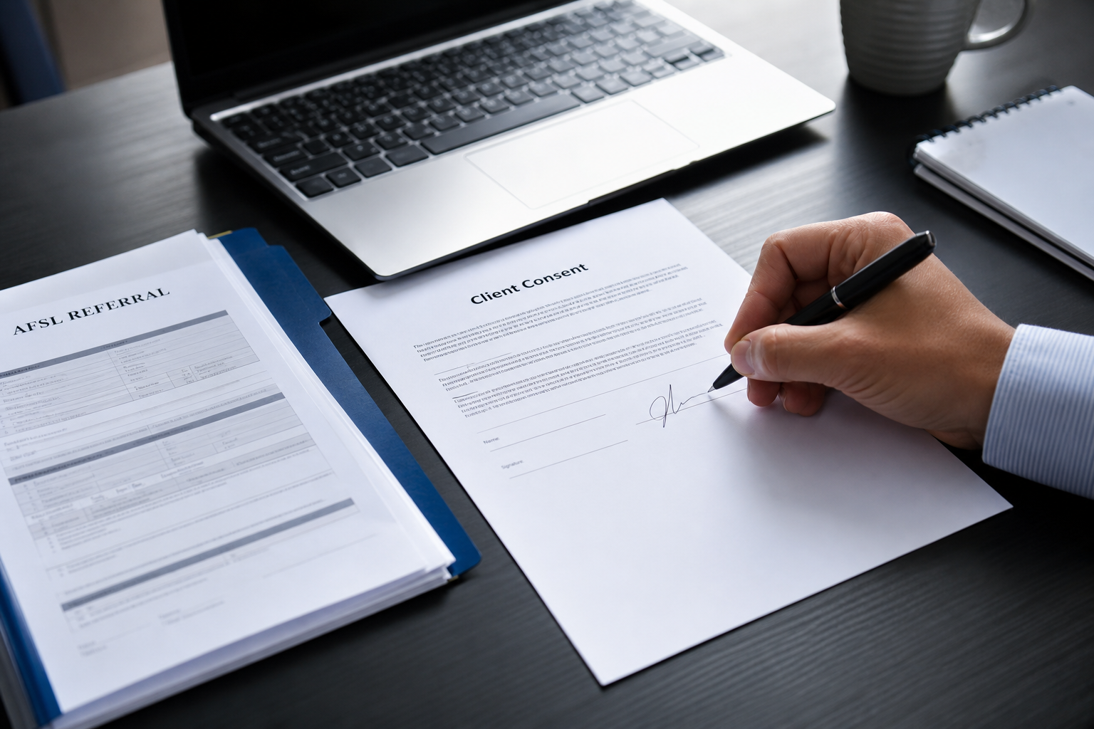 Referral consent paperwork on a consultation desk